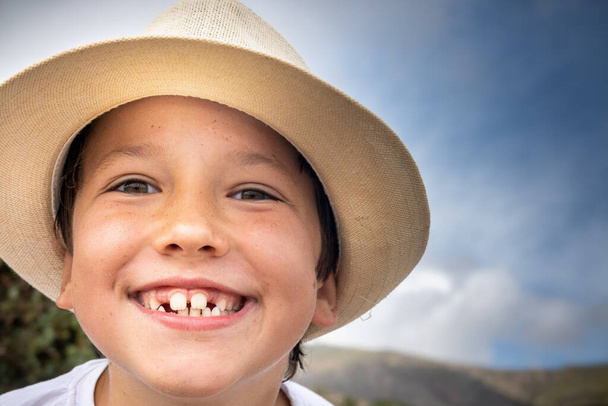 Close up of boy showing missing teeth - Photo, Image