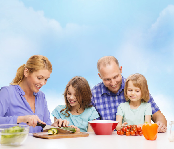 Happy family with two kids making dinner at home - Φωτογραφία, εικόνα