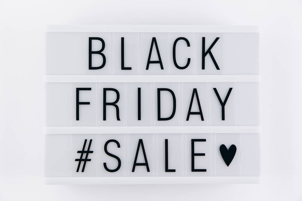 Creative promotion composition Black friday sale text on lightbox on white background - Photo, Image