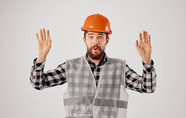 Emotional worker orange hard hat safety work construction - Photo, Image