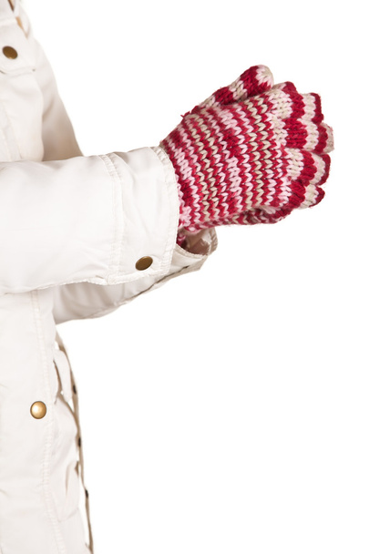 Woman hand in colorful and warm gloves isolated on white - Foto, afbeelding