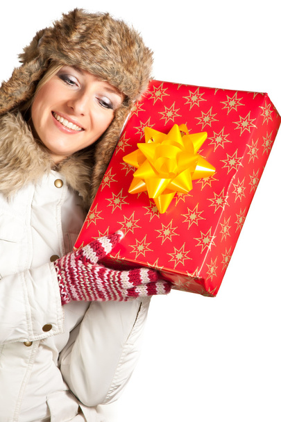 Caucasian blond woman in furry hat and christmas gifts isolated on white - Foto, immagini
