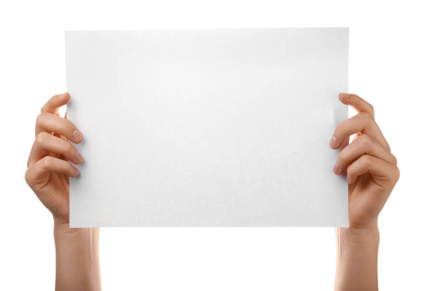 Female hands with blank paper sheet on white background - Foto, Imagen