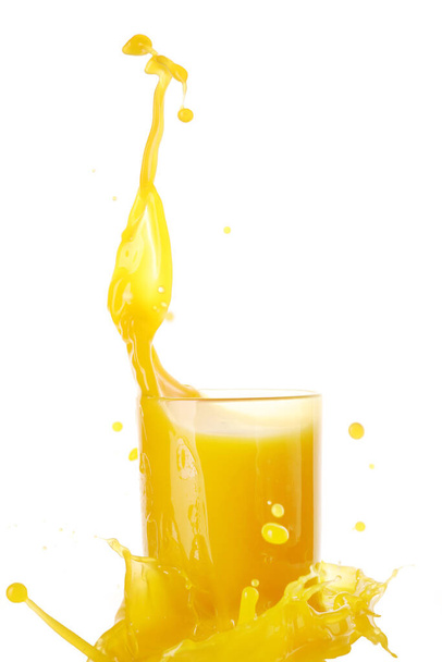 Glass of fresh mango juice with splash on white background - Photo, Image