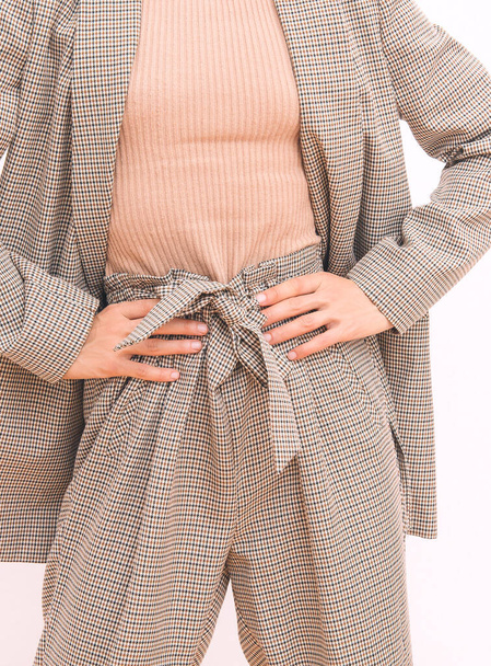 Stylish retro Lady. Details of everyday look. Casual beige checkered suit.Trendy Minimalistic style. Fashion fall winter spring look book. - Fotoğraf, Görsel