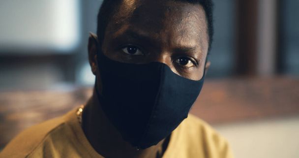 Serious black man in protective textile mask - Photo, Image