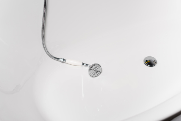 High angle view of shower in white bathtub  - Fotoğraf, Görsel