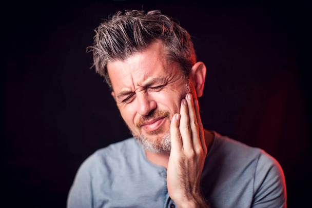 Man feels toothache. People, healthcare and medicine concept - Photo, Image