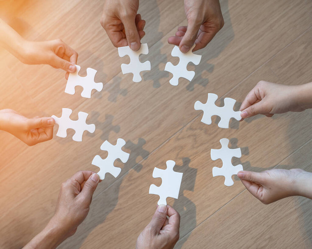 Teamwork idea brainstorming, team partnership connection for problem solving, finding solution in hope concept with puzzle jigsaw pieces in school children or student kids's hands - Fotoğraf, Görsel