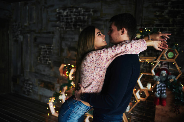 Lovers in the Christmas house. Cozy indoor photo session - Photo, Image