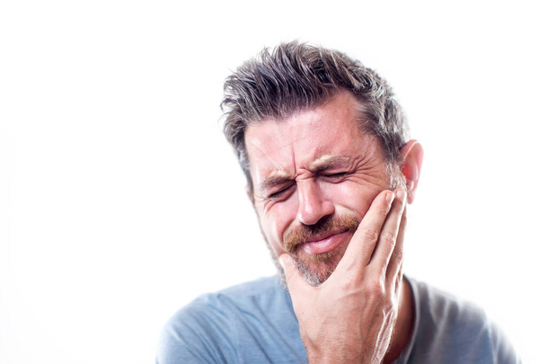 Male feels strong toothache isolated. People, healthcare and medicine concept  - Zdjęcie, obraz
