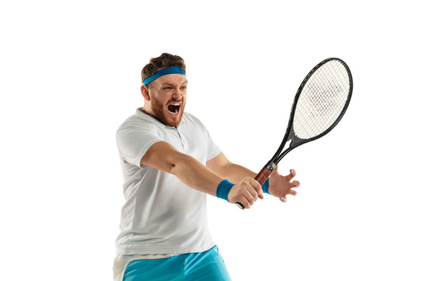 Funny emotions of professional tennis player isolated on white studio background, excitement in game - Фото, изображение