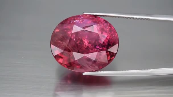natural pink tourmaline rubellite on the grey background - Footage, Video