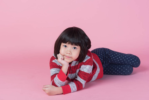 cute girl on pink background, lovely kid - Fotó, kép