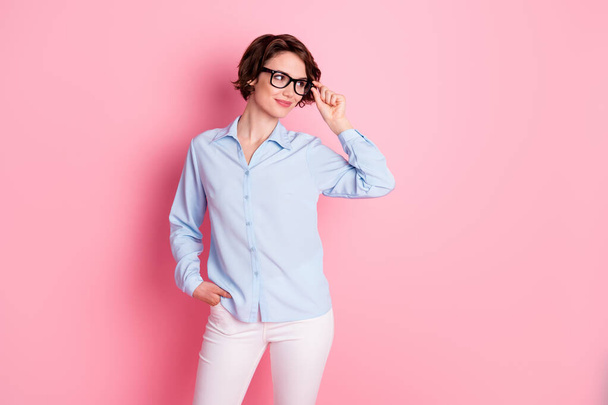 Portrait of her she nice attractive cheery content brown-haired girl employer ceo boss chief agent broker touching specs healthy vision looking aside copy space isolated pink pastel color background - Fotografie, Obrázek