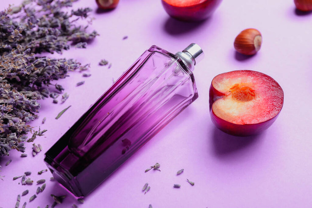 Composition with bottle of perfume and lavender on light background - Photo, Image