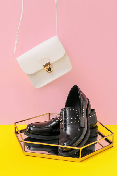 Stylish female shoes and bag on color background - Фото, изображение