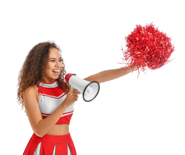 Beautiful young cheerleader with megaphone on white background - Фото, изображение