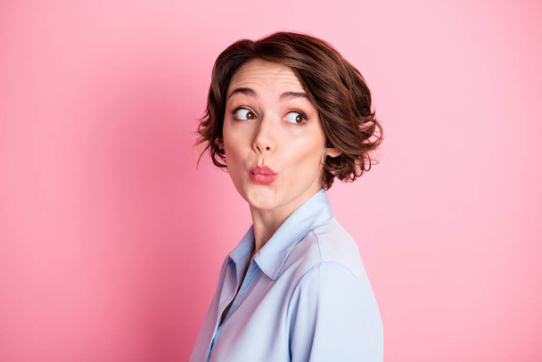 Closeup profile photo of attractive funny girlish lady tricky look side empty space childish person wanna know secret gossip wear blue office shirt isolated pink pastel color background - Foto, Imagem