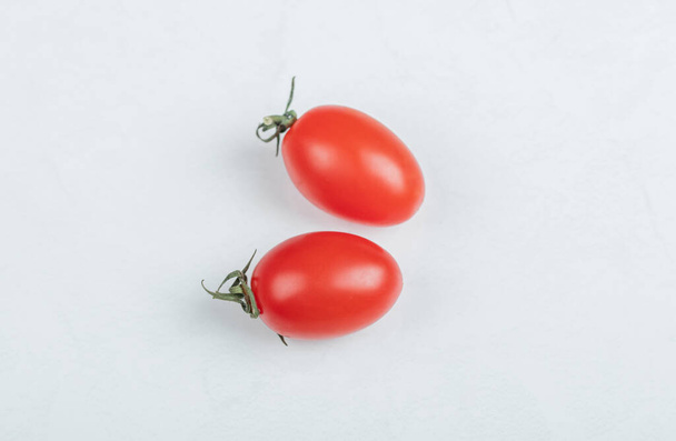 Close up photo of two cherry tomato. on white background - Photo, Image
