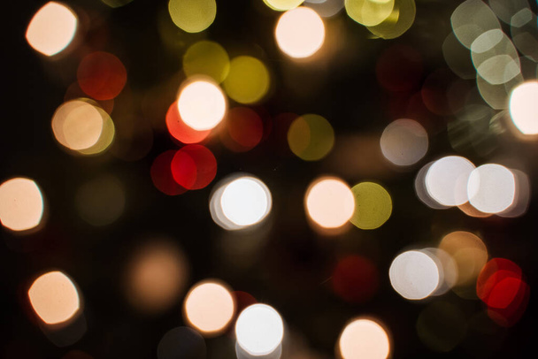 small lights garlands hanging on a white wall, taken in the evening, close-up, macro photography - 写真・画像