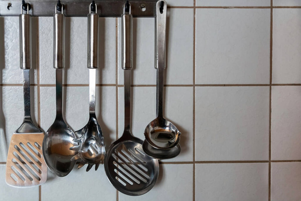 kitchen utensils on a wall in the kitchen - Photo, Image