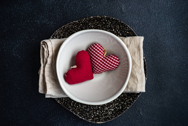 Place setting with heart shaped decoration for St. Valentine Day dinner - Foto, imagen