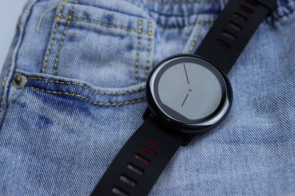 Touch smart watch on denim background - Photo, Image