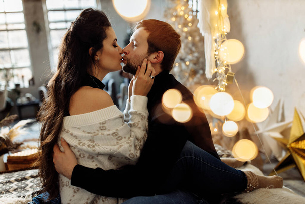 happy couple in love  relaxing in room with christmas decor - Foto, Imagem