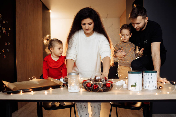young happy family baking on  the christmas night at home - Fotografie, Obrázek
