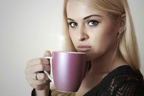 Beautiful blond woman drinking Coffee. Cup of tea. Hot drink - Foto, immagini