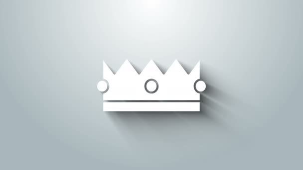 Valkoinen kruunu kuvake eristetty harmaalla taustalla. 4K Video motion graafinen animaatio - Materiaali, video