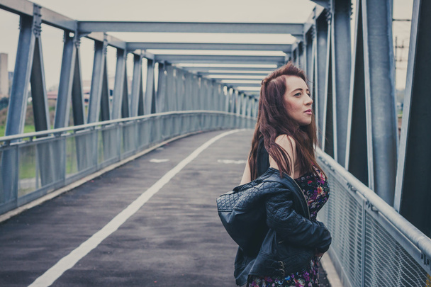 Pretty girl posing on a bridge - Zdjęcie, obraz