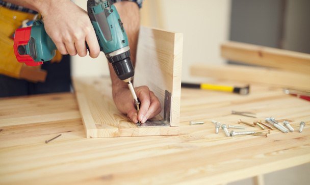 Carpenter working with drill - Photo, Image