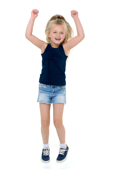 Happy girl jumping with raising hands - Photo, image