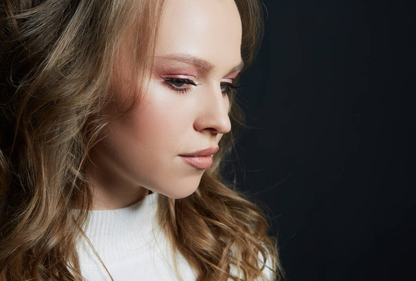 Portrait of beautiful woman model with fresh daily makeup and romantic wavy hairstyle - 写真・画像
