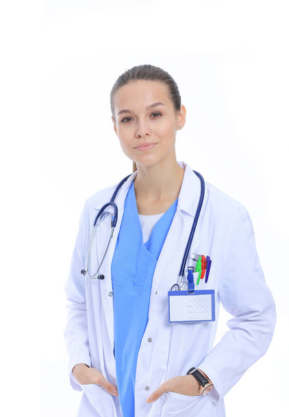 Beautiful young woman in white coat posing with hand in pocket. Woman doctor - Photo, image
