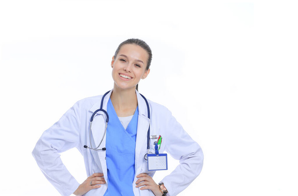 Beautiful young woman in white coat posing with hand in pocket. Woman doctor - Foto, immagini