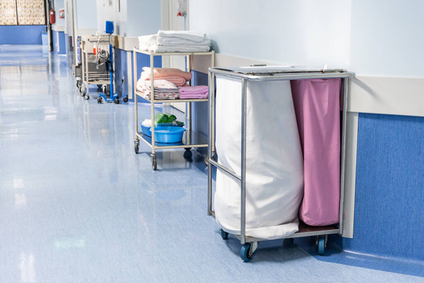 Laundry bags collect dirty used linen of patients at hospital ward - Foto, Bild