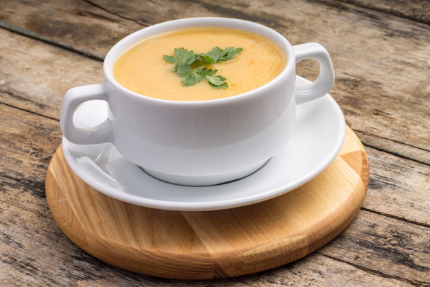 Pea soup on wood weathered background - Valokuva, kuva