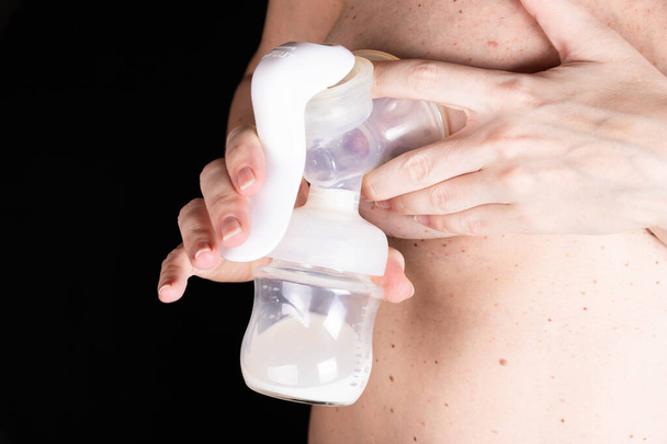 young woman expresses breast milk with a manual breast pump. Concept of breastfeeding - Foto, Imagem