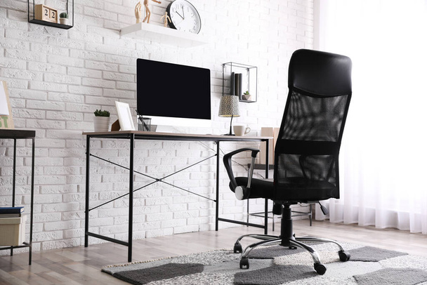 Comfortable chair near desk in modern office interior - Fotografie, Obrázek