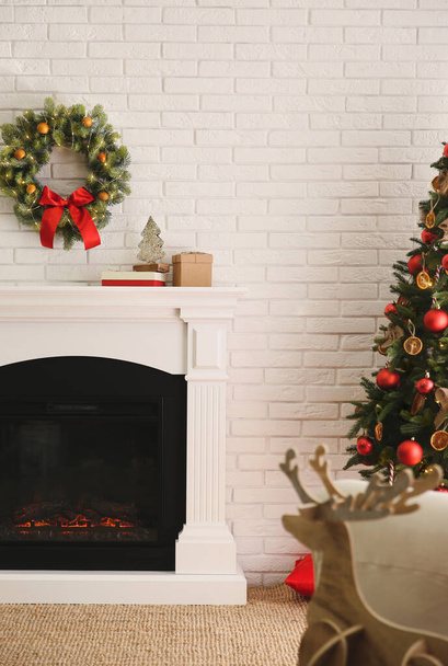 Modern fireplace in living room decorated for Christmas - Photo, image