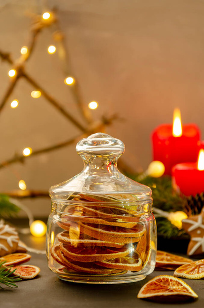 dried oranges in a glass jar. Homemade dried oranges slices in the jar. - Foto, Imagen