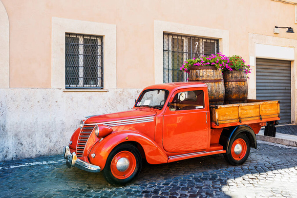 Vintage red pickup on street in Trastevere. Rome, Italy. - 写真・画像