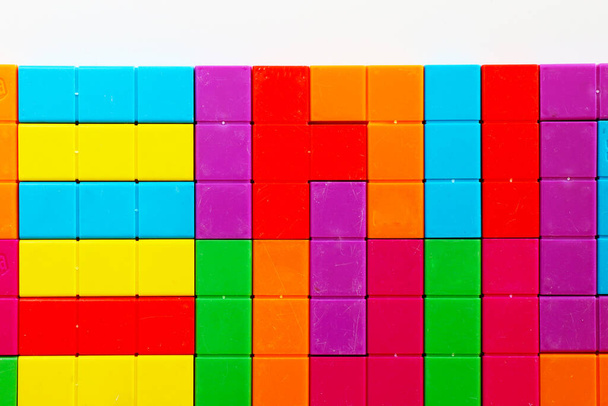 Colorful puzzle cubes background, geometric figures, table game, multicolored - Foto, Imagem