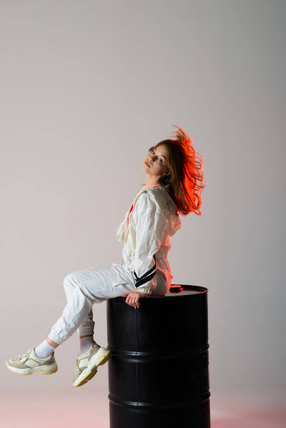 Young beautiful dancer posing on studio background - Fotografie, Obrázek