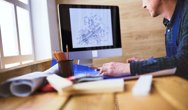 Architect working on drawing table in office - Foto, Imagem