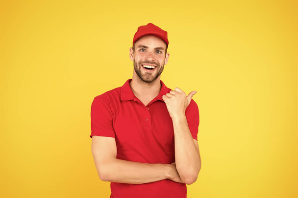 Worker courier. friendly man in uniform. portrait of smiling deliveryman. job and people concept. his first job. part-time job for student. Happy Male Janitor. Smiling Janitor In Uniform At Office - Foto, immagini