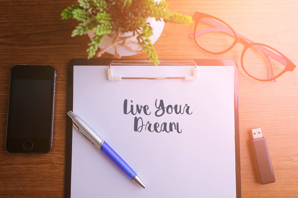 Business concept - Top view notebook writing Live Your Dream - Photo, Image
